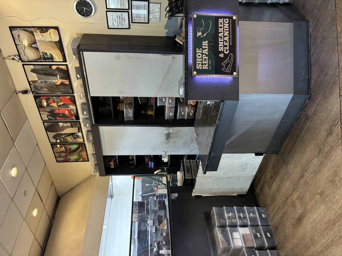 Inside Heel Quik — the workshop counter at Suite 102, Lenox Square